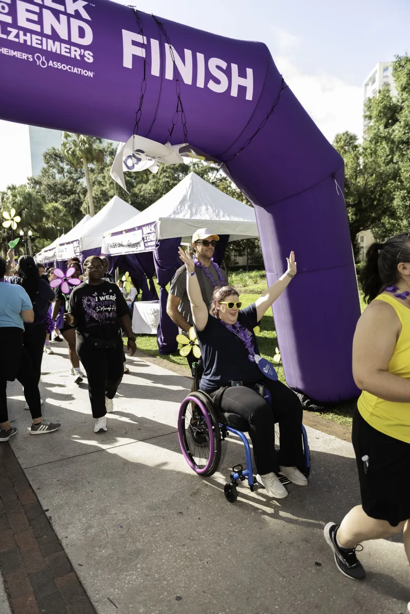 Woman in wheelchair crosses finish line at Walk to End Alzheimer's